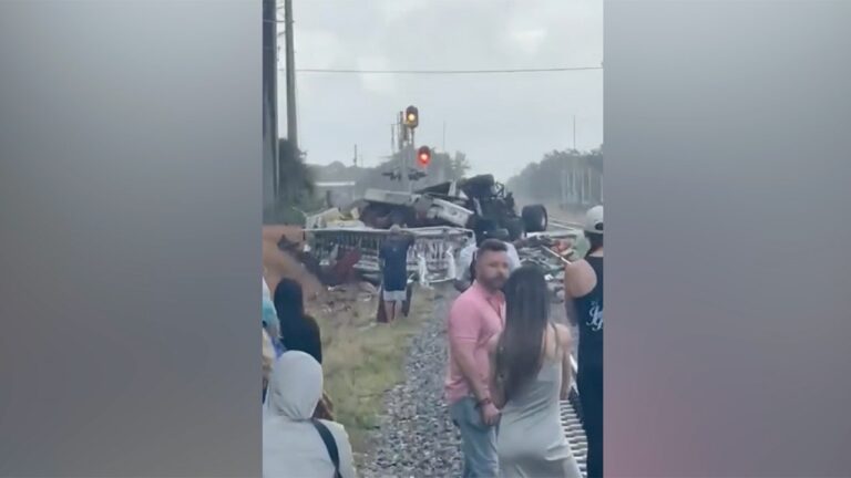 Firefighters and passengers were injured when a Florida train crashed into a fire truck