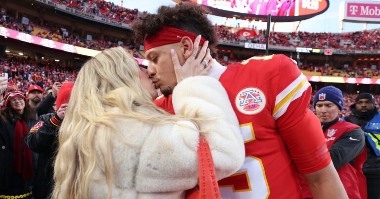 Brittany Machom kisses her husband Patrick before the capital game AFC