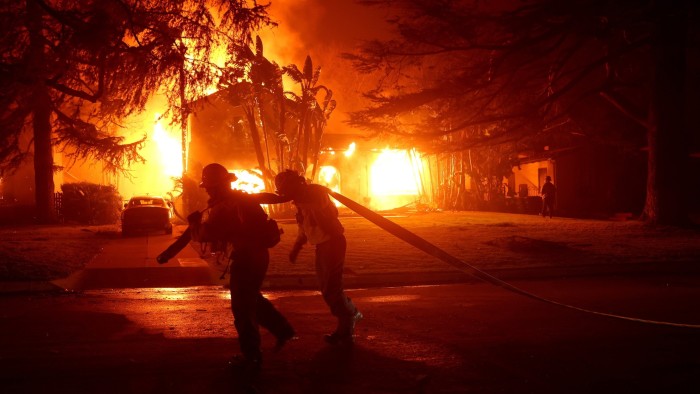 At least 5 dead as wildfires devastate upscale Los Angeles enclaves