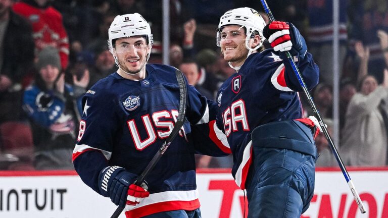 American hockey star Zach Werensky reacts to the national anthem